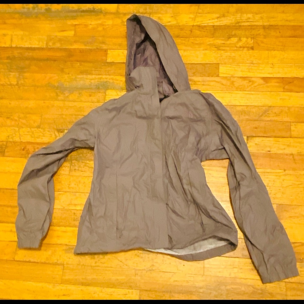 A large grey North Face winter jacket